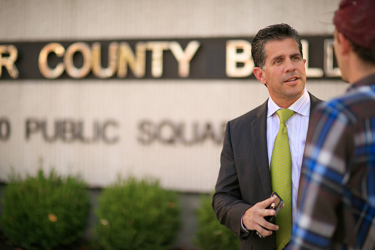 Photo of attorney Civella with a client